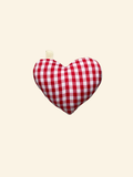 Puffy fabric heart bag charm made from red white check fabric on a cream background